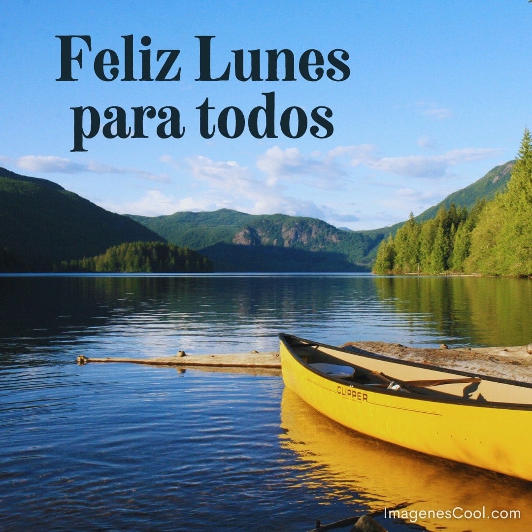 Un lago tranquilo y montañas, con un texto que desea feliz lunes y un canoa amarilla